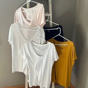 Five banana republic tees. Two white one navy, one light pink and one mustard